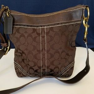 Coach momogram hobo brown purse.